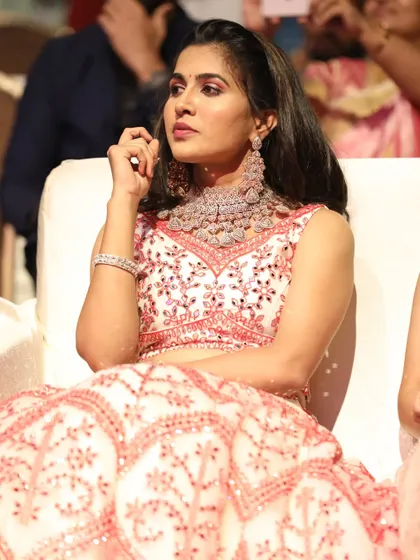 A candid shot of the model looking radiant in our jewellery during an awards ceremony. The necklace sits perfectly and catches the light beautifully.