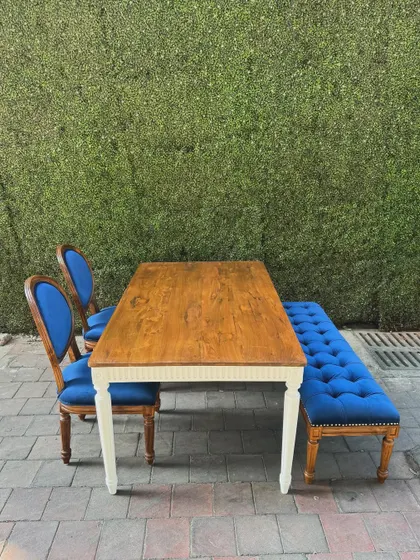 A top-down view of the dining set, showing the contrast between the blue upholstery and the wooden table.