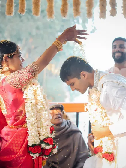 The 'Talambralu' ritual in a South Indian wedding is a beautiful and playful blessing. We captured the bride showering the groom with turmeric-coated rice, a symbol of prosperity, health, and happiness.