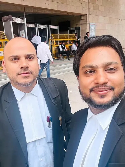 With a fellow advocate outside Rohini Court. We work together to ensure our clients receive the best possible representation.