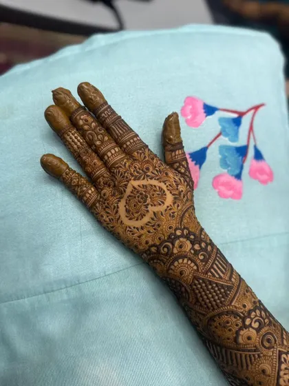 A close-up of the heart motif, showcasing the detailed work inside and around it.