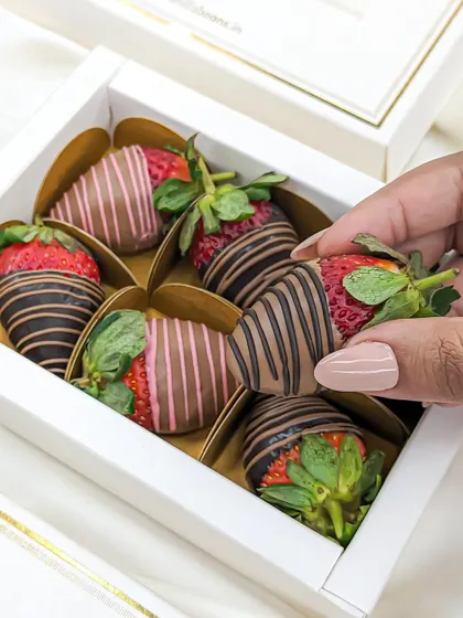Each strawberry is carefully placed in its own holder within the gift box, ensuring they arrive looking as good as they taste.
