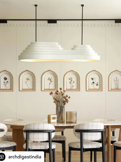 The dining area of KAIA, with its custom light fixture and wall art, was another beautiful shot from our feature in Architectural Digest. It highlights our commitment to bespoke details that tell a story.