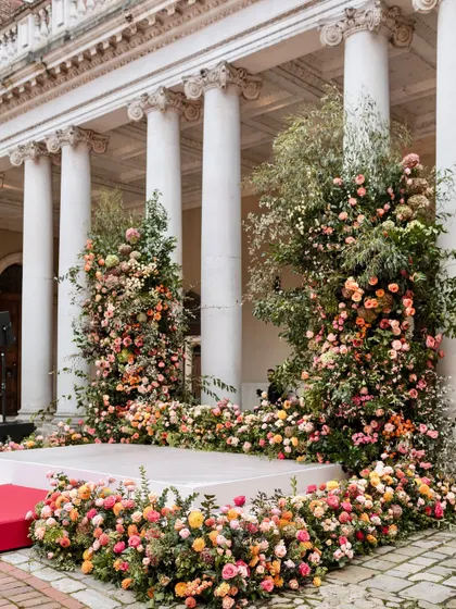 Different angles of the stunning floral mandap and ceremony setup at Hampton Court Palace, showing the scale and detail of the design.