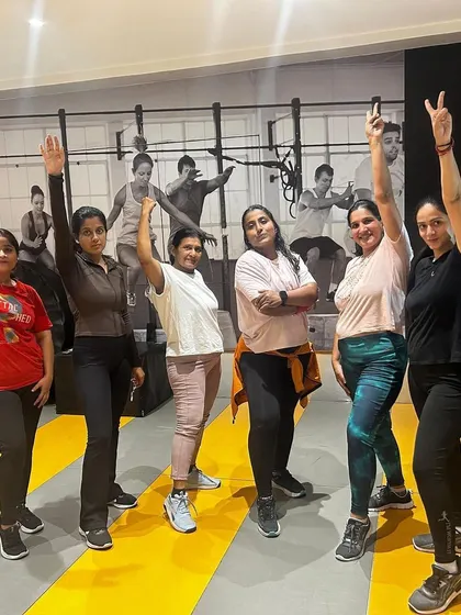 Our members celebrating their fitness achievements together. The supportive atmosphere is perfect for anyone, from beginners to experienced gym-goers.