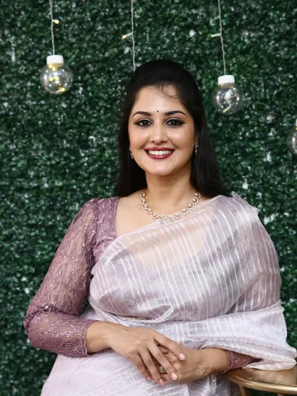 Actress Neetha Ashok looks radiant in my striped rose gold organza saree. The subtle shimmer and full-sleeve sequin blouse make it a sophisticated choice for any special occasion.