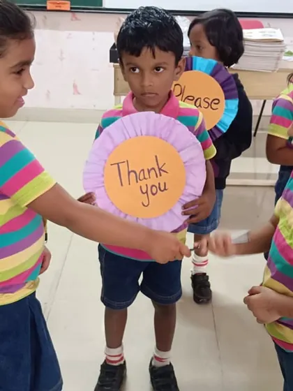 Learning to show gratitude is a key life skill. Here, students practice saying 'Thank you' in a classroom activity.