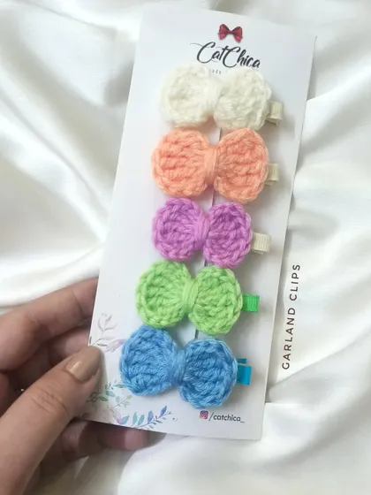 Our "Garland" set of mini crochet bow clips in beautiful pastel shades.