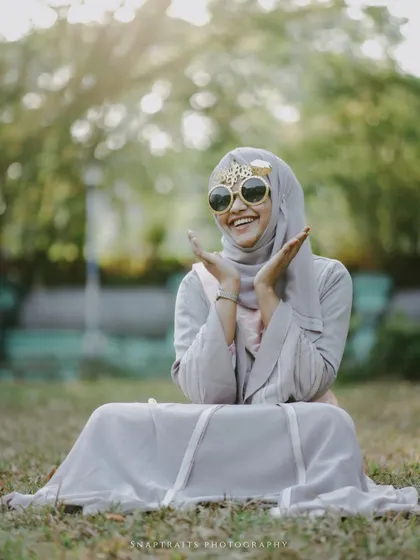 The bride-to-be's infectious joy is perfectly captured in this candid shot from her outdoor bridal shower.