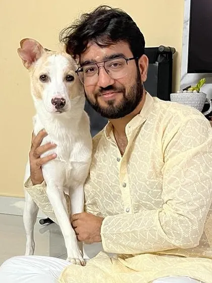 LAILA AKA BELLA IS HOME. This is Bella (formerly Laila) with her dad. Adopted as a tiny Indie pup, she has grown into a beautiful, loved dog.