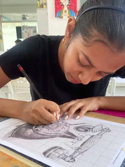 This student is working on a detailed sketch of a vintage telephone, using the grid method for accuracy. Our sketching course covers how to render different textures and objects realistically.