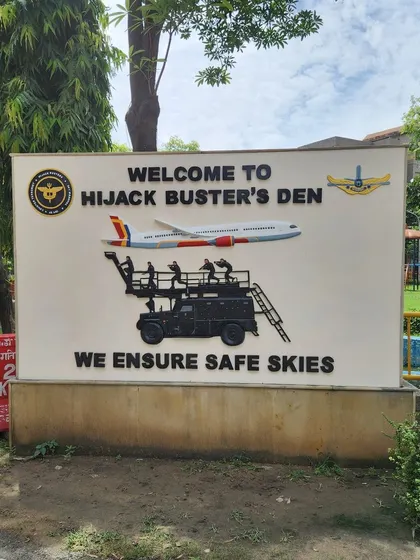 Another FRP relief art sign made for the NSG's 'Hijack Buster's Den'. This detailed piece features raised elements like the airplane and response vehicle, showcasing our skill in creating complex, narrative-driven signage.