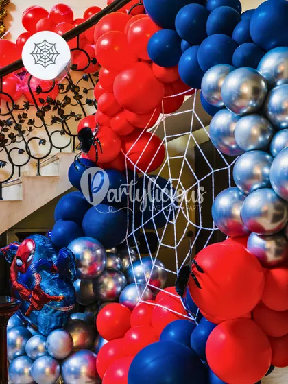 Your friendly neighborhood Spider-Man swings into the party. This dynamic balloon arch uses classic red, blue, and silver, complete with web details and a Spidey foil balloon, to create a super-powered entrance.