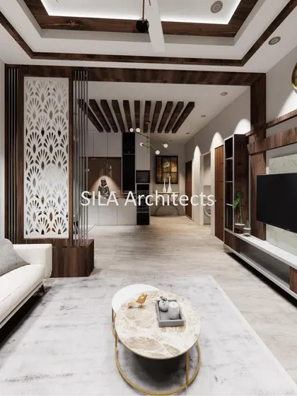 This perspective showcases the entertainment area, with a sleek TV unit, custom partition with intricate jali work, and a cohesive design that flows through the entire living space.