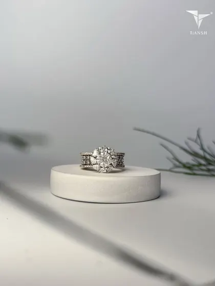 This floral inspired ring captures the essence of wild blossoms. Crafted in gold and crowned with radiant diamonds, it speaks of elegance and eternity, a true whisper of the earth.