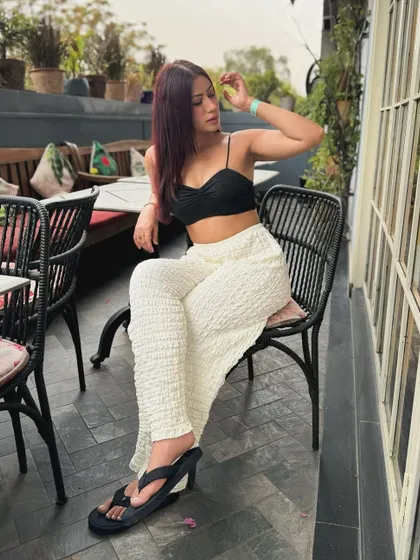Posing in the chic and comfy black and white outfit.