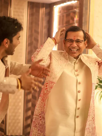 It's all about family. A joyful, candid moment capturing the happiness of the groom's father during the celebration.