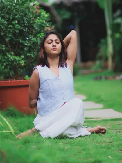 A serene moment in Gomukhasana (Cow Face Pose). This posture deeply stretches the shoulders, chest, and hips, promoting good posture and releasing tension.