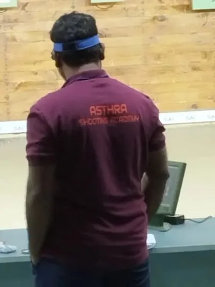 A shooter from our academy reviews his shot on the monitor during the state competition. Analyzing every shot is crucial for improvement.