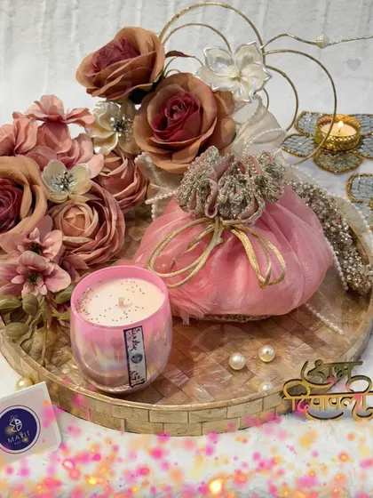 Another one of my signature Diwali hampers. This one features a pink 'potli', a scented candle, and beautiful 't-light' holders, all arranged on a lovely tray.