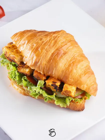 Our Paneer Tikka Croissant Sandwich. A delicious fusion of flavours with spiced paneer tikka, crisp lettuce, and veggies packed into a freshly baked croissant.