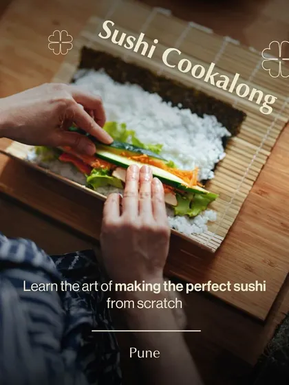 A participant in our Pune workshop learns the art of making the perfect sushi roll from scratch. This overhead shot shows the careful layering of ingredients on the bamboo mat.