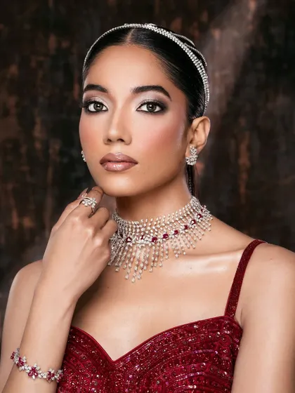 This portrait highlights the complete jewelry set, showing how the choker, earrings, and bracelet work together to create a cohesive, luxurious look.