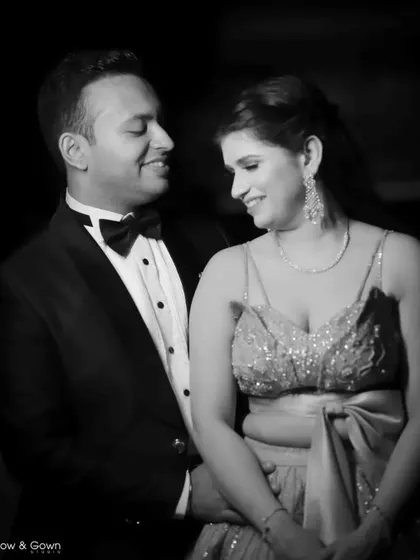 A classic black and white portrait from an engagement shoot. The couple's loving gaze and the soft lighting create a timeless and romantic image.
