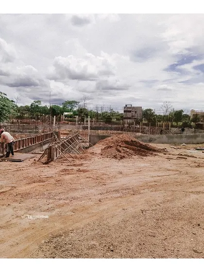 An early construction photo of the memorial site. This image shows the initial groundwork and foundation being laid, marking the very beginning of the building's journey from a plan on paper to a physical reality.