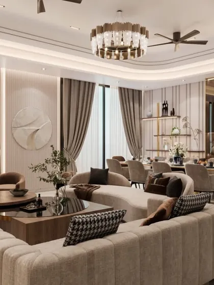 Another angle of the luxurious living space, showcasing the layered lighting, plush seating, and a large wall clock as a design element. The neutral color palette is accented with rich textures and metallic details.