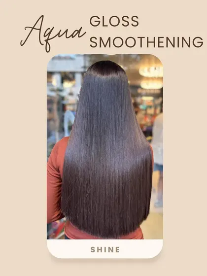 This highlights the incredible shine achieved with Aqua-Gloss Smoothening, ideal for hair prone to dryness and frizz.