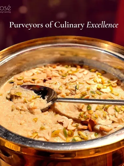 A rich and creamy Indian dessert, possibly kheer or rabri, generously garnished with nuts. As purveyors of culinary excellence, we ensure our traditional desserts are authentic and delicious.