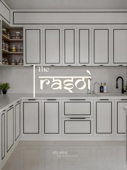 This is 'The Rasoi', a kitchen I designed to be the true heart of the home. The clean lines, monochrome palette with bold black borders, and smart storage solutions make it both highly functional and beautifully inspiring for everyday cooking and family moments.