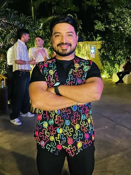 A photo from a fun evening out, wearing a colorful vest that expresses my personality. We believe in being bold and vibrant in every aspect of life.