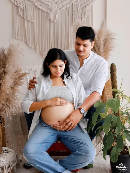 A relaxed and intimate portrait of a couple in casual wear. This style captures the authentic connection between partners in a comfortable, natural setting.
