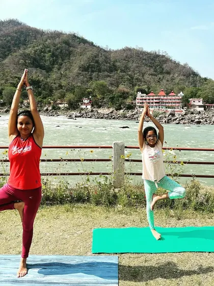 Sharing the practice of Vrikshasana (tree pose) with my daughter by the river. Children are natural imitators, and it brings me immense joy to share this gift of yoga and mindfulness with her.