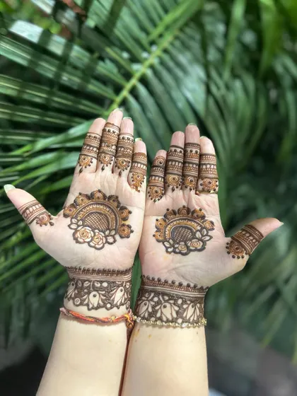 A simple and pretty design for a guest, with a floral cuff and mandala.
