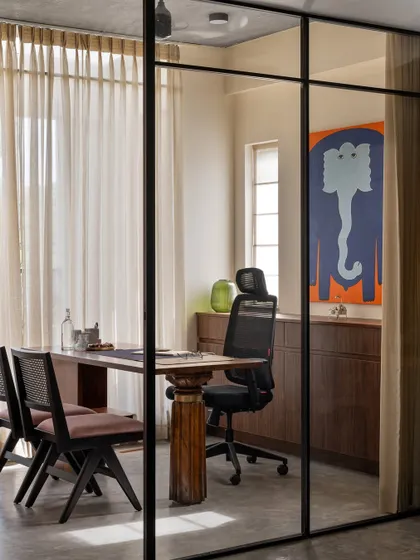 My personal cabin is designed for privacy while maintaining a visual connection to the studio. The desk itself embodies our philosophy, pairing a sourced vintage teak leg with a contemporary tabletop, a true juxtaposition of traditional and modern design.