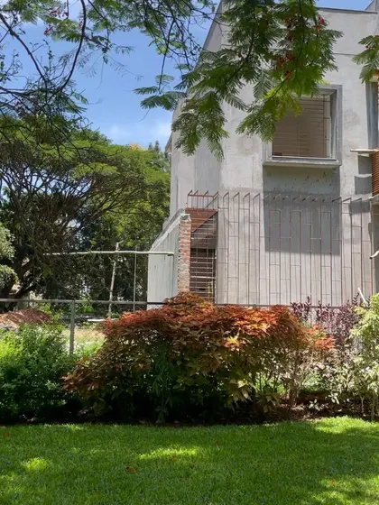 The house seen from the garden, with its raw concrete finish yet to be painted.