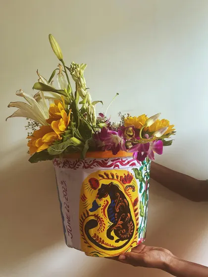 This is the third side of the multi-faceted planter, featuring a powerful panther design with folk-art motifs. This single item showcases a range of styles, from portraiture to animal art.