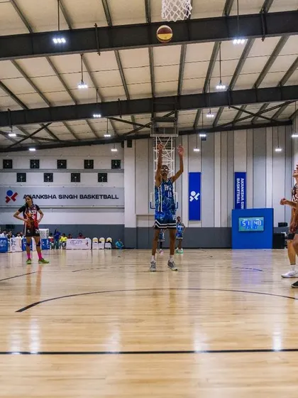 A player at the free-throw line, calm amidst the action. Mental focus is just as important as physical skill in clutch moments.