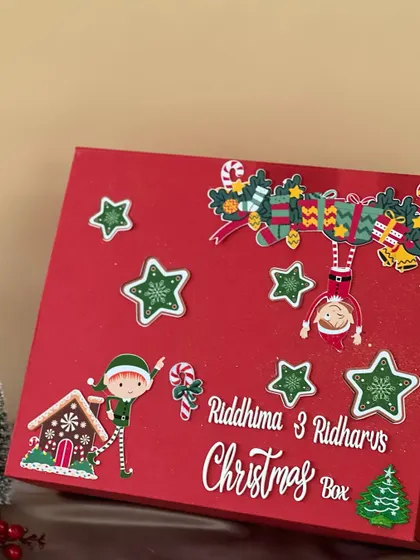 Another custom Christmas box, this one for siblings Riddhima and Ridhar. I decorated it with cute elf and gingerbread house cutouts to bring the festive spirit to life.