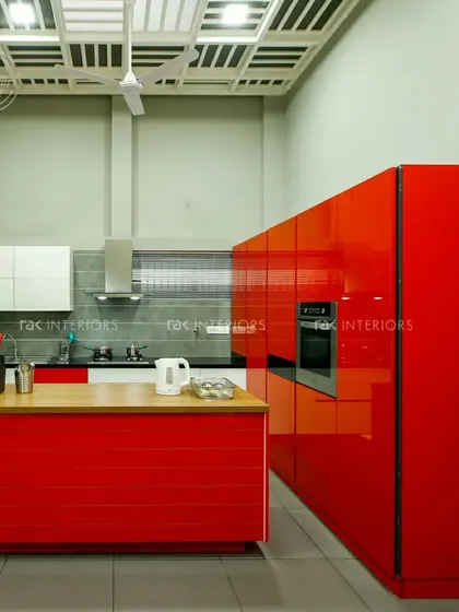 A striking, modern kitchen in a glossy, bright red finish. This design is for those who are not afraid to make a bold statement.