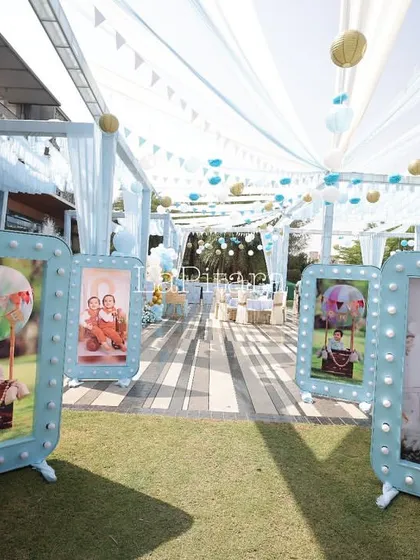 A gallery of memories. I created these large, illuminated photo frames to display pictures of the birthday twins, adding a personal and heartfelt touch to the entrance walkway of their royal-themed party.