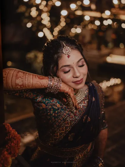 A serene and beautiful close-up of the bride, her intricate henna and jewelry on full display.