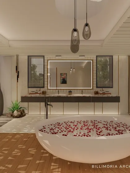 A closer look at the freestanding tub and the double vanity in the background. The design uses a mix of materials, including wood, marble, and pebbles, to create a rich, textural experience.