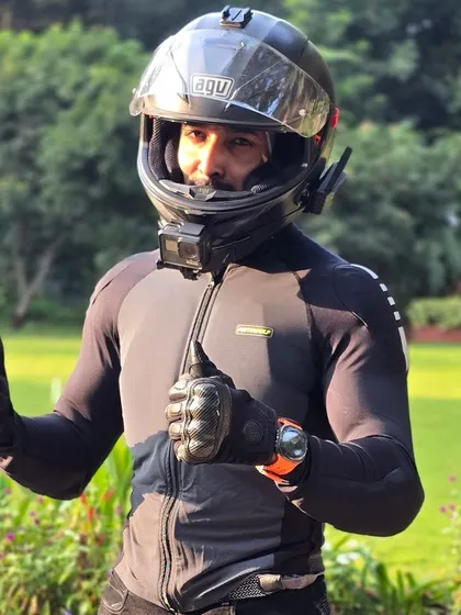 Thumbs up for safety. A full set of gear, including helmet and gloves, is mandatory for anyone joining my rides. No compromises.