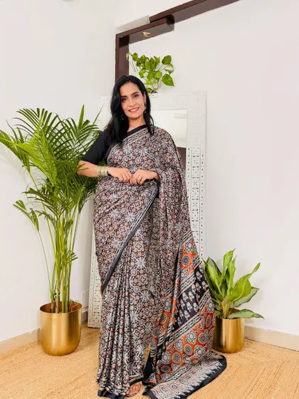 A beautiful printed satin crepe saree from Myntra that's perfect for work. This one has a lovely Kalamkari-inspired print in earthy tones. It's home-washable and under 1000 rupees.