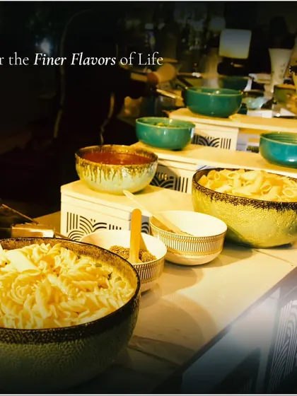 A close-up of a pasta station, showcasing different types of pasta and sauces in stylish bowls. We offer a wide array of culinary options to suit any event theme.