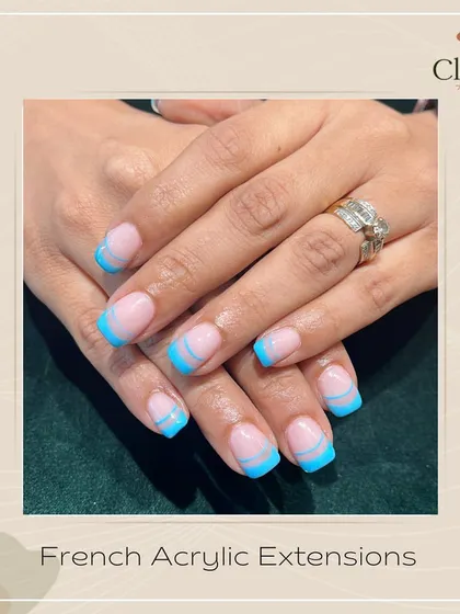 Putting on some beach vibes with this double French design. The two tones of blue on these acrylic extensions will have you dreaming of a summer holiday.